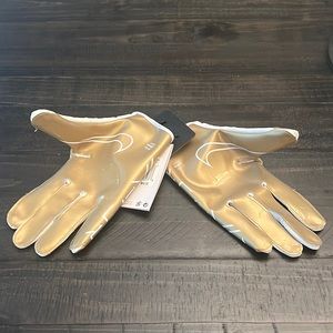 Brand new Nike football gloves in men’s Large.
